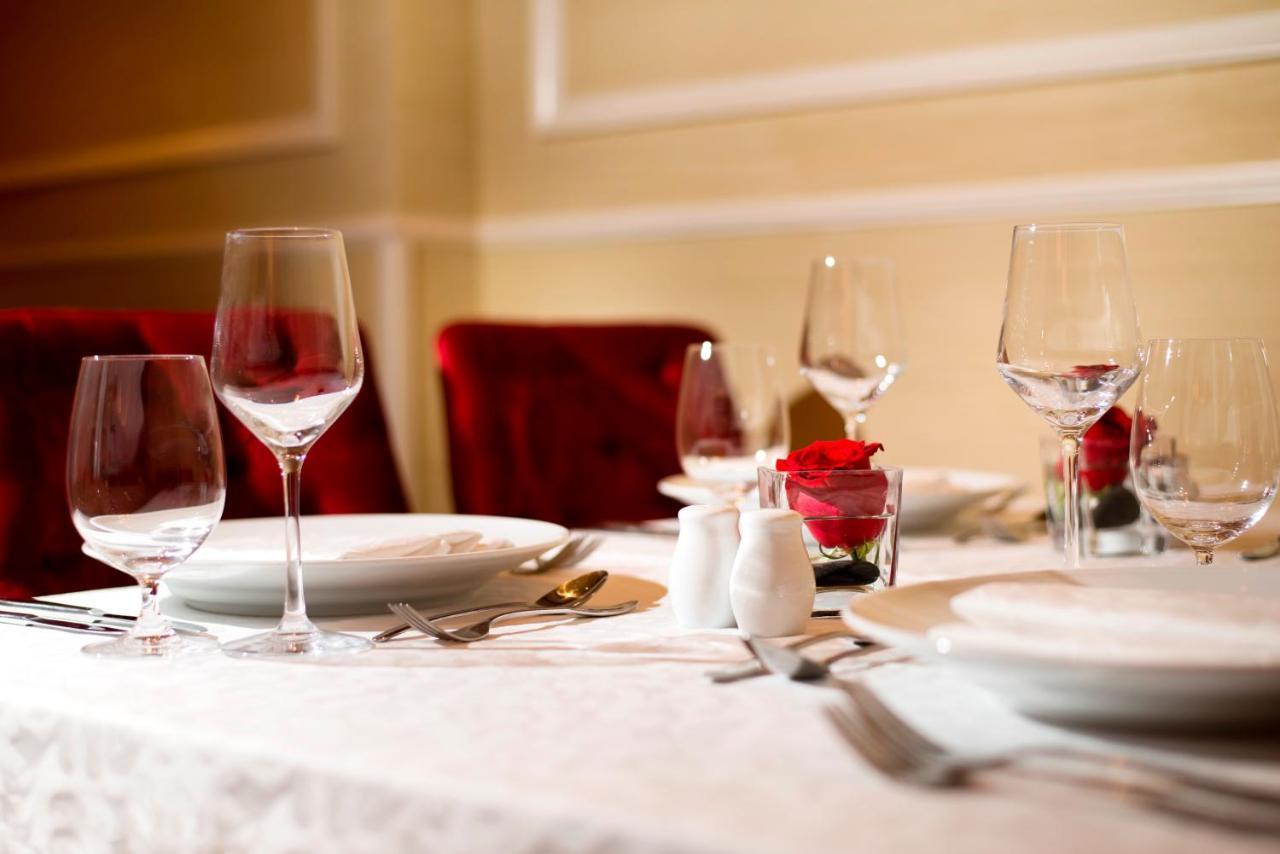 Warwick Doha Hotel Exterior photo A table set for fine dining